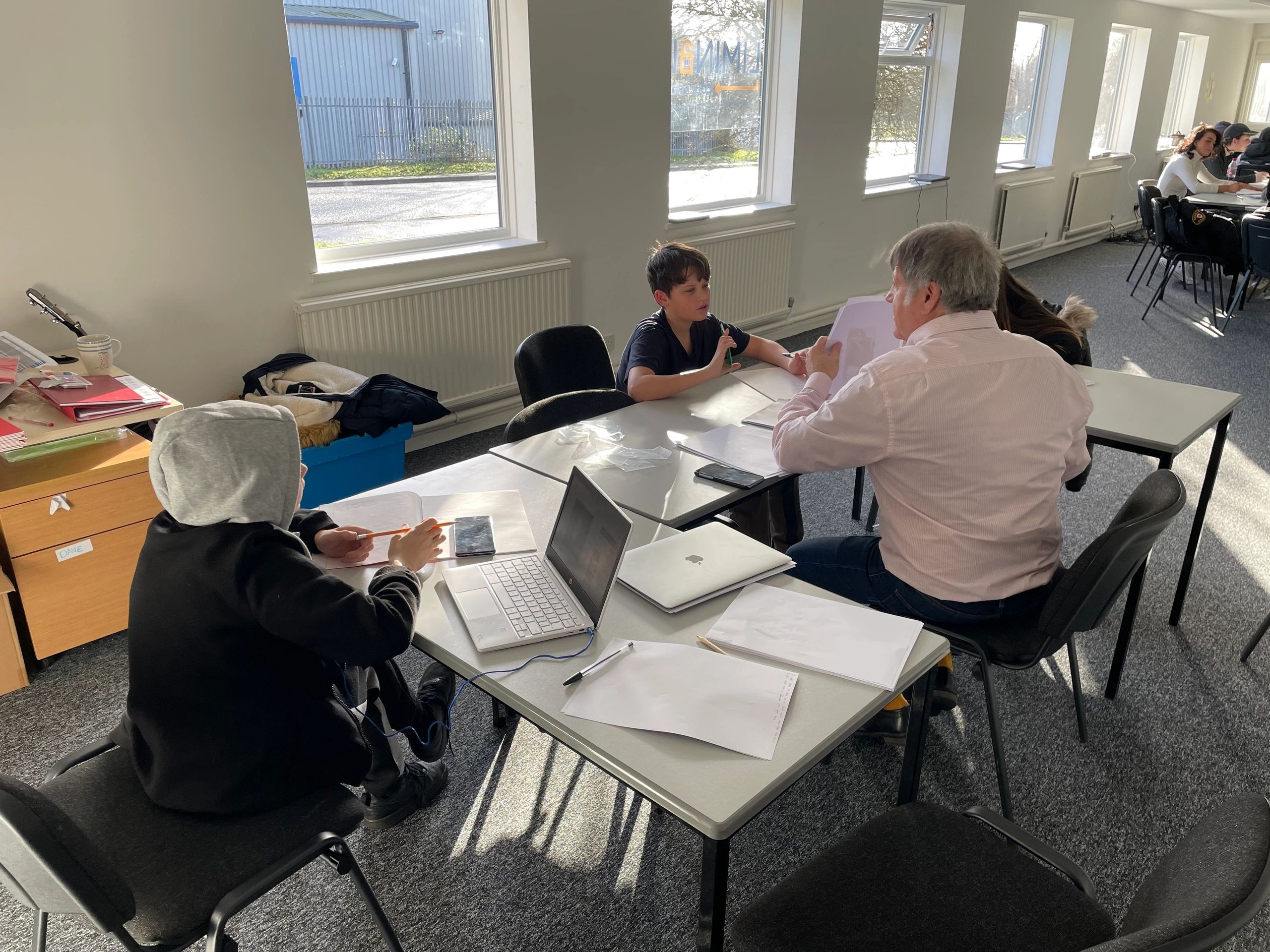Students working with a tutor